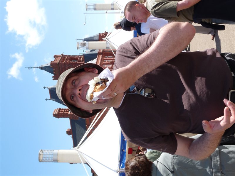 Paul eating a rather large chocolate eclair