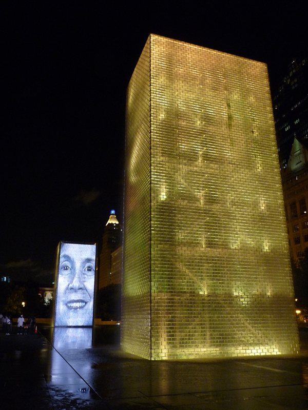 The Human Gargoyle fountain illuminated at night