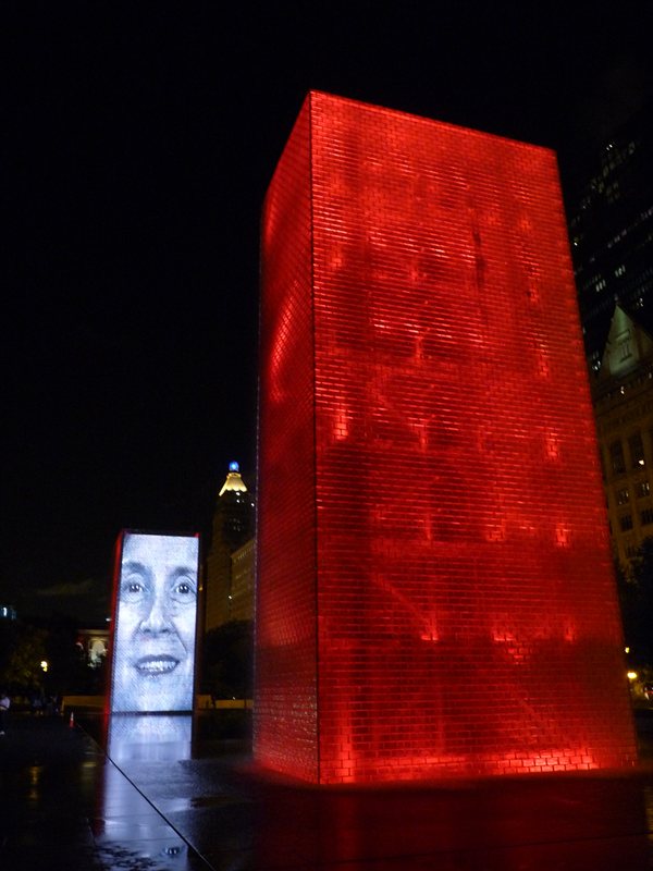 The Human Gargoyle fountain illuminated at night