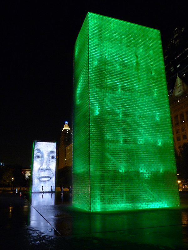 The Human Gargoyle fountain illuminated at night
