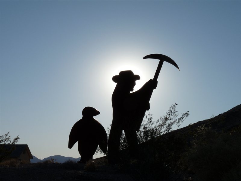 Penguin and Miner Sculpture