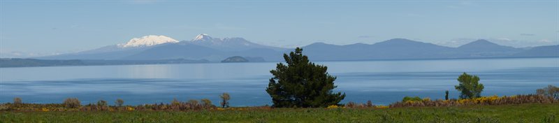 Panoramic view over Lake Taupo and the mountains beyond