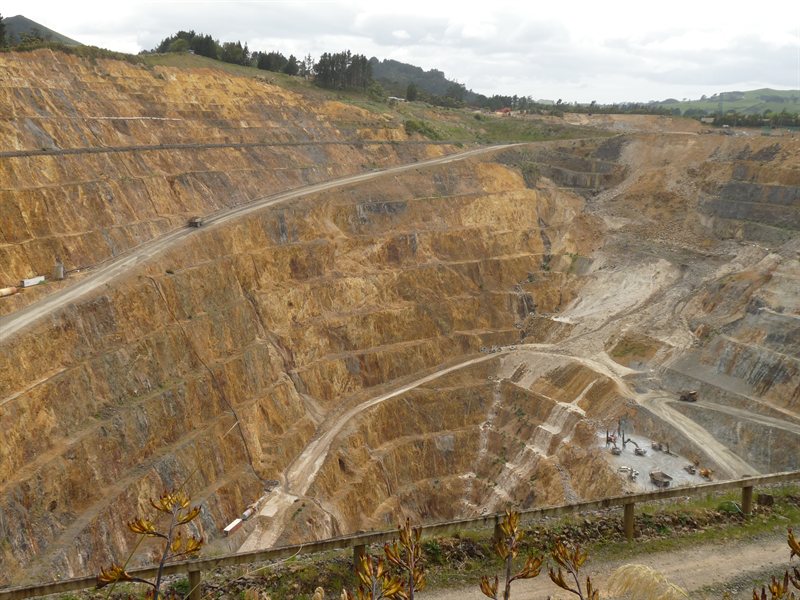Waihi goldmine with dump truck going up ramp