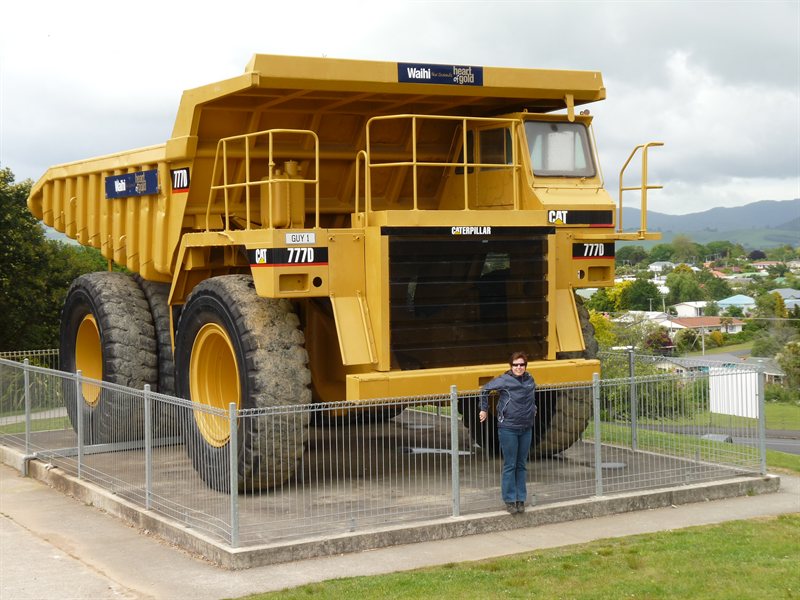 Claire next to a dump truck