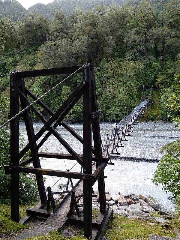 Claire on a swing bridge on the way to Roberts Point
