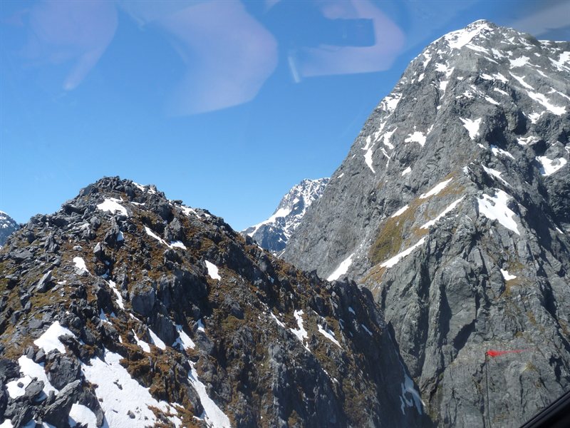 Flying between craggy peaks in the helicopter