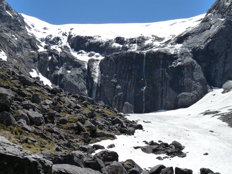 Snow and waterfalls next to the Homer Tunnel