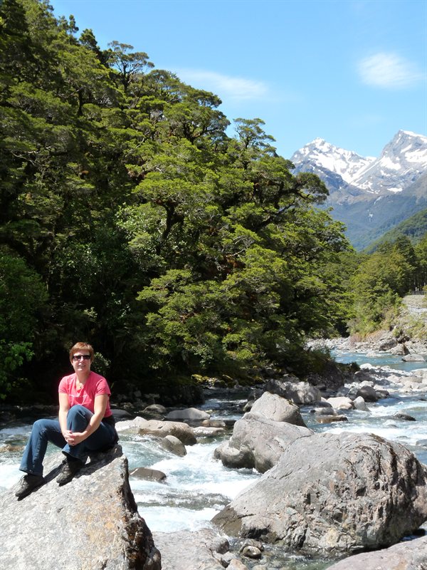Claire and a river next to the Milford Sound road
