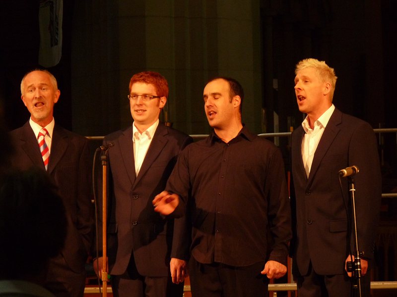 Quartet singing Deck the Halls