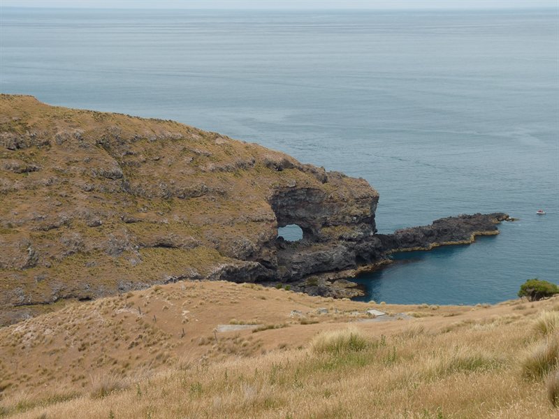 Holey rock at Akaroa Point
