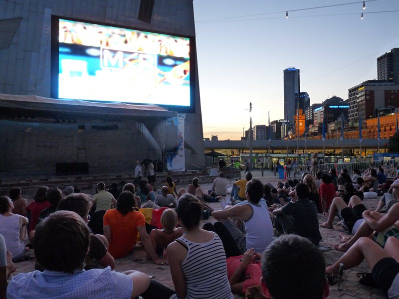 Crowds watching the tennis in Federation Square