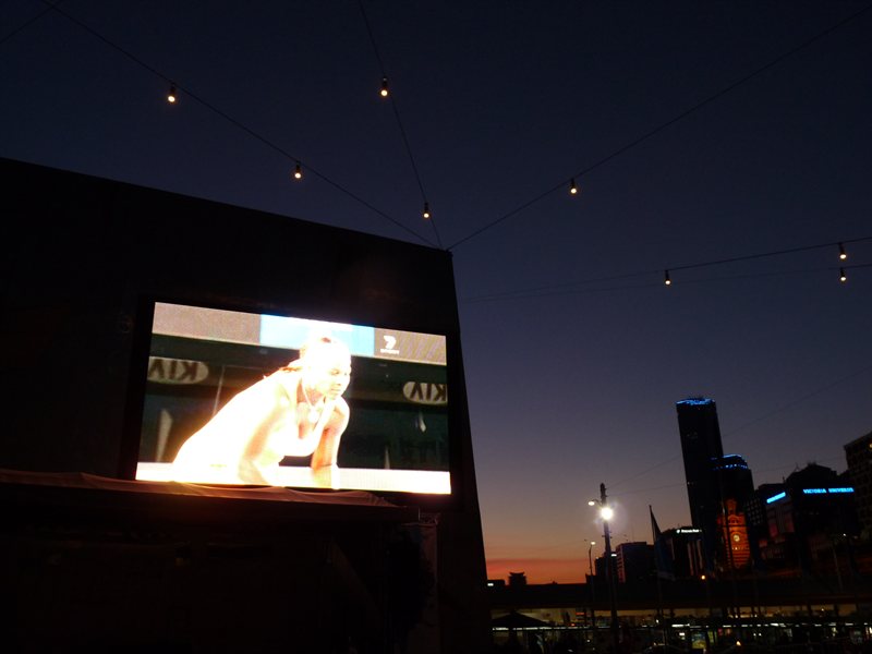 Watching the tennis in Federation Square