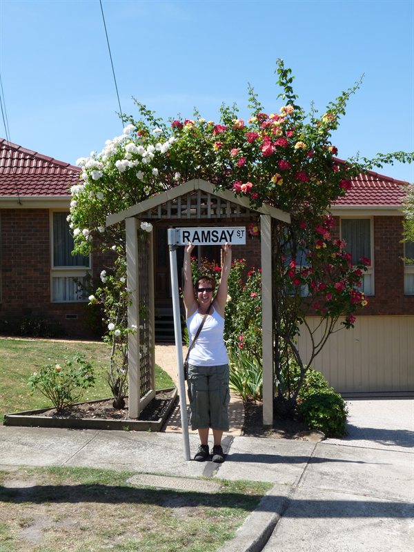 Claire with the Ramsey Street sign