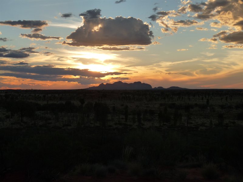 Sunsetting behind Kata Tjutu