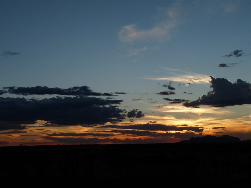 Sunsetting behind Kata Tjutu