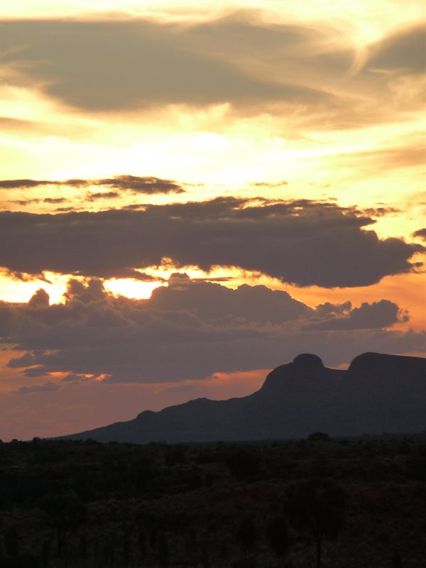 Sunsetting behind Kata Tjutu