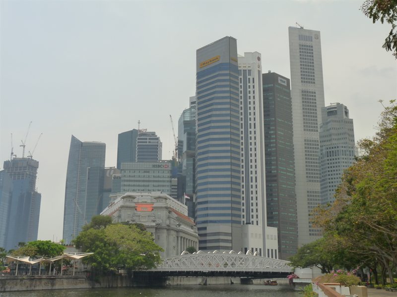 The Fullerton Hotel nestled at the bottom of the skyscrapers