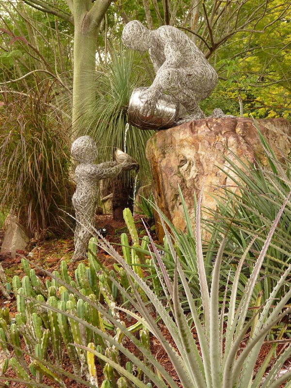 'Passing on knowledge' sculpture at the botanic gardens