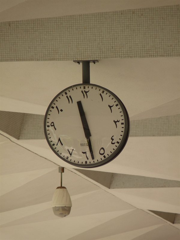 Arabic numbers on a clock inside the Mosque