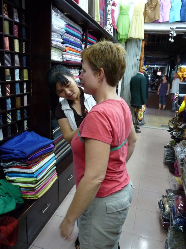 Getting measured at the tailors
