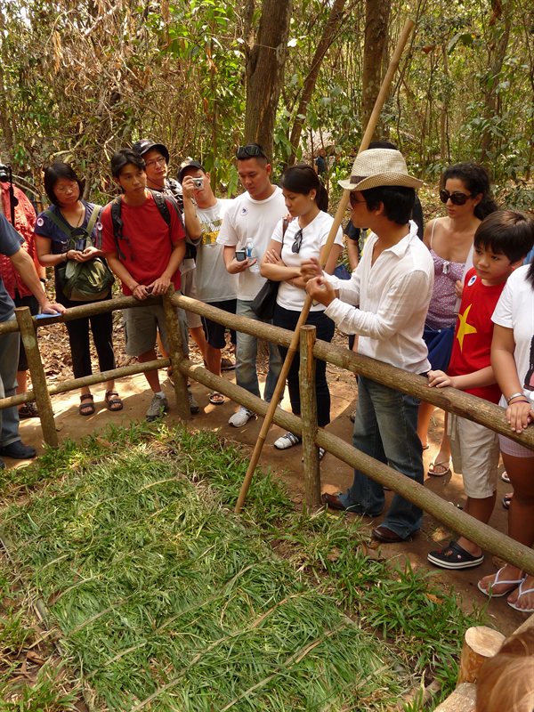 Demonstrating a Viet Cong trap