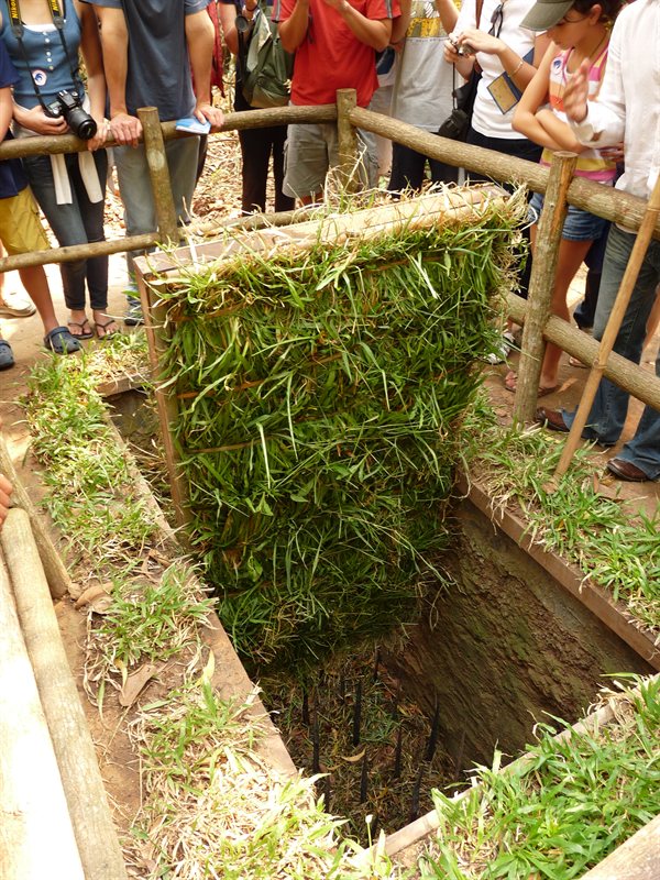 Demonstrating a Viet Cong trap