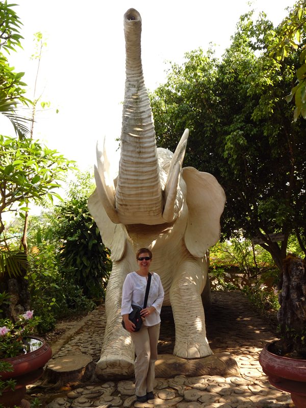 Claire with an elephant at a pagoda in Dalat