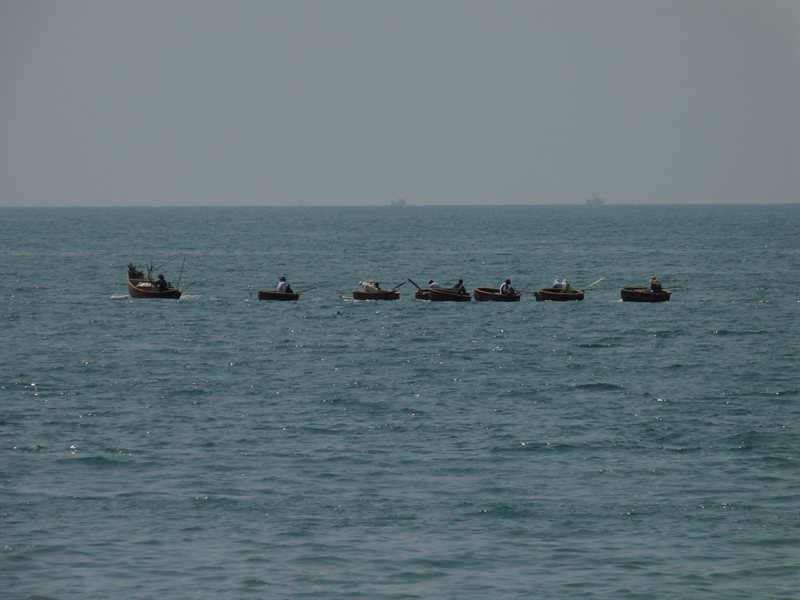 Round fishing boats out at sea
