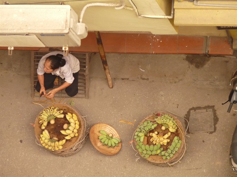Selling bananas beneath our balcony