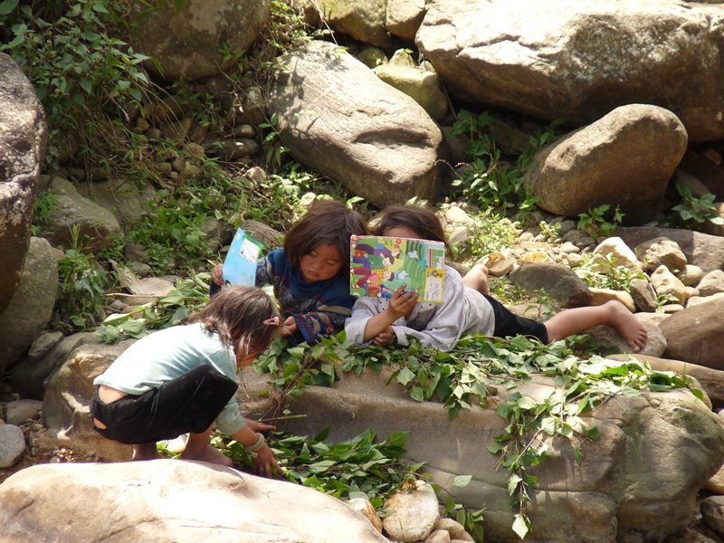 Hiding behind her book
