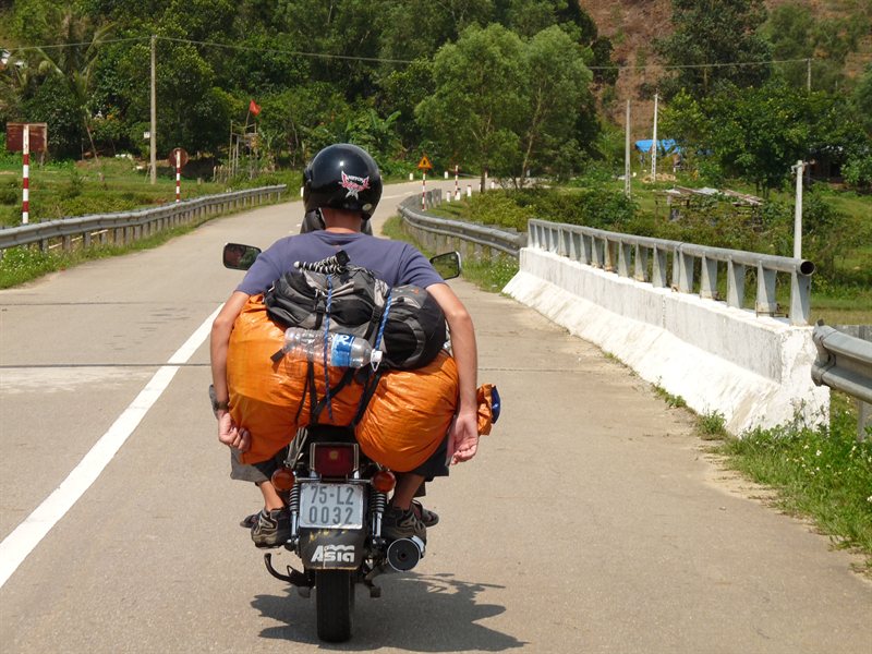 Ed relaxing on the back of Tam's bike