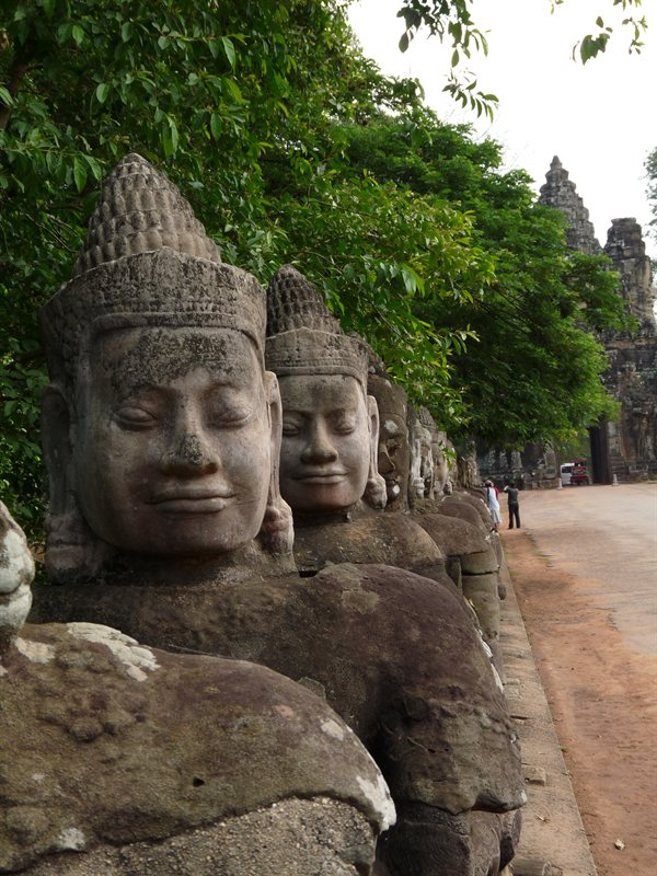Buddahs lining the way the Bayon Temple South Gate
