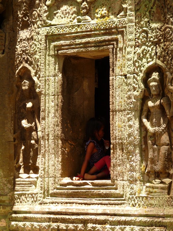 Intricate carvings around a window at Ta Prohm, the Tomb Raider temple