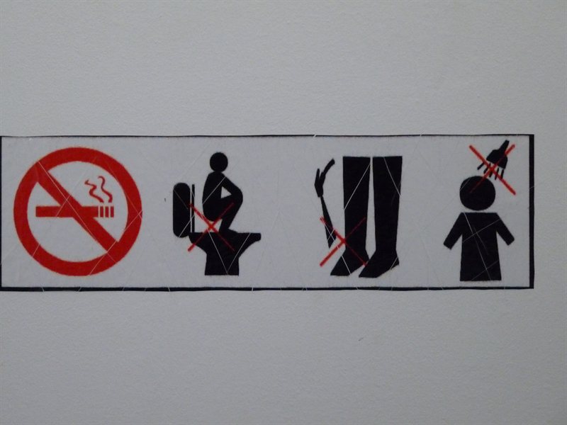 Warning sign in the toilets at Banteay Srei