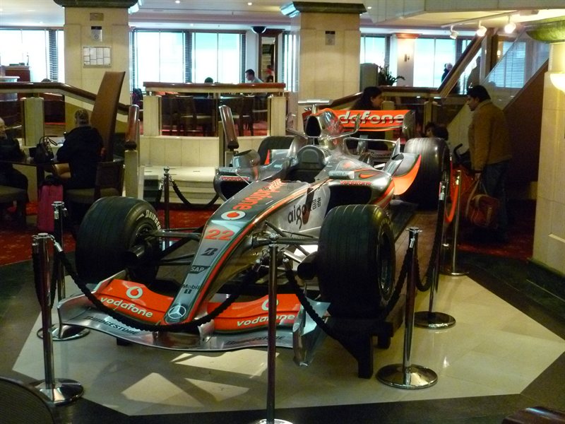 F1 car parked in the hotel bar